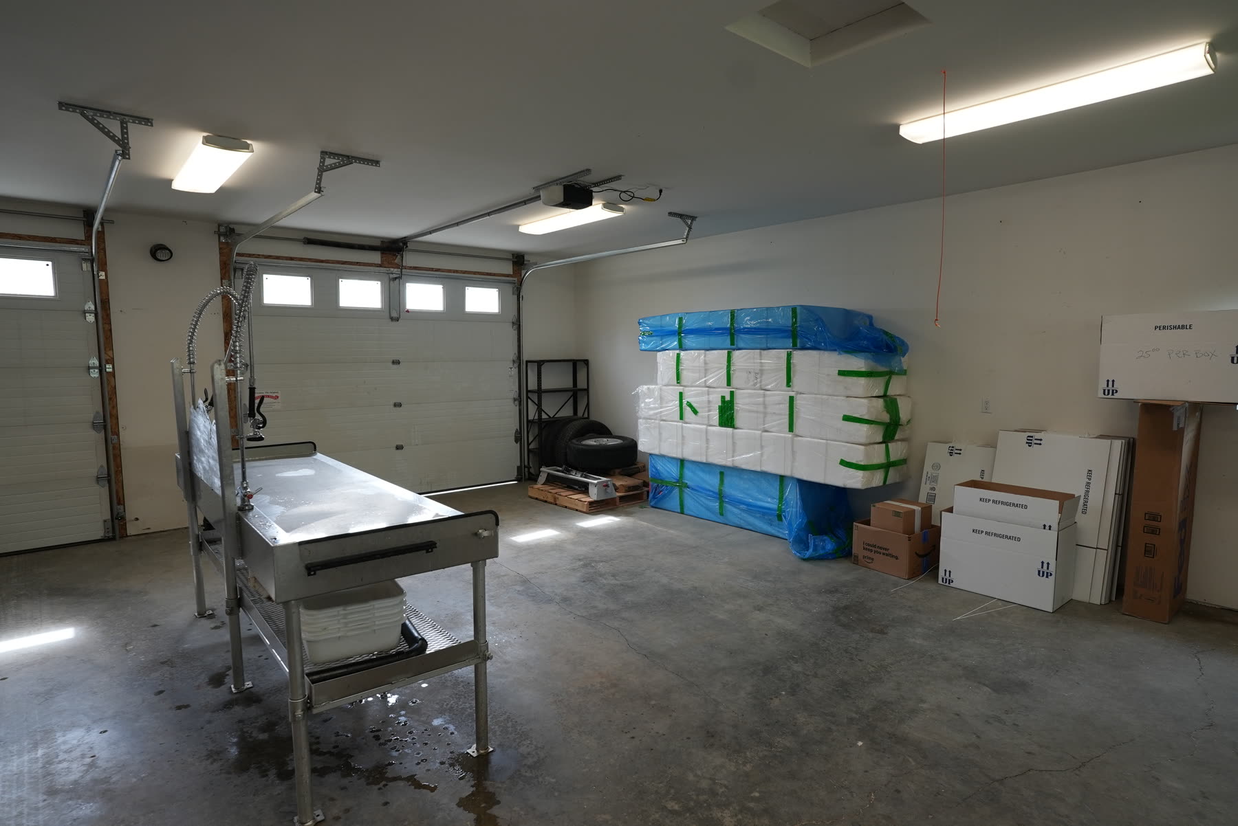 Garage with a stainless fish cleaning table